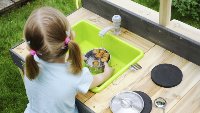 Cooking with whatever nature has to offer in an outdoor play kitchen